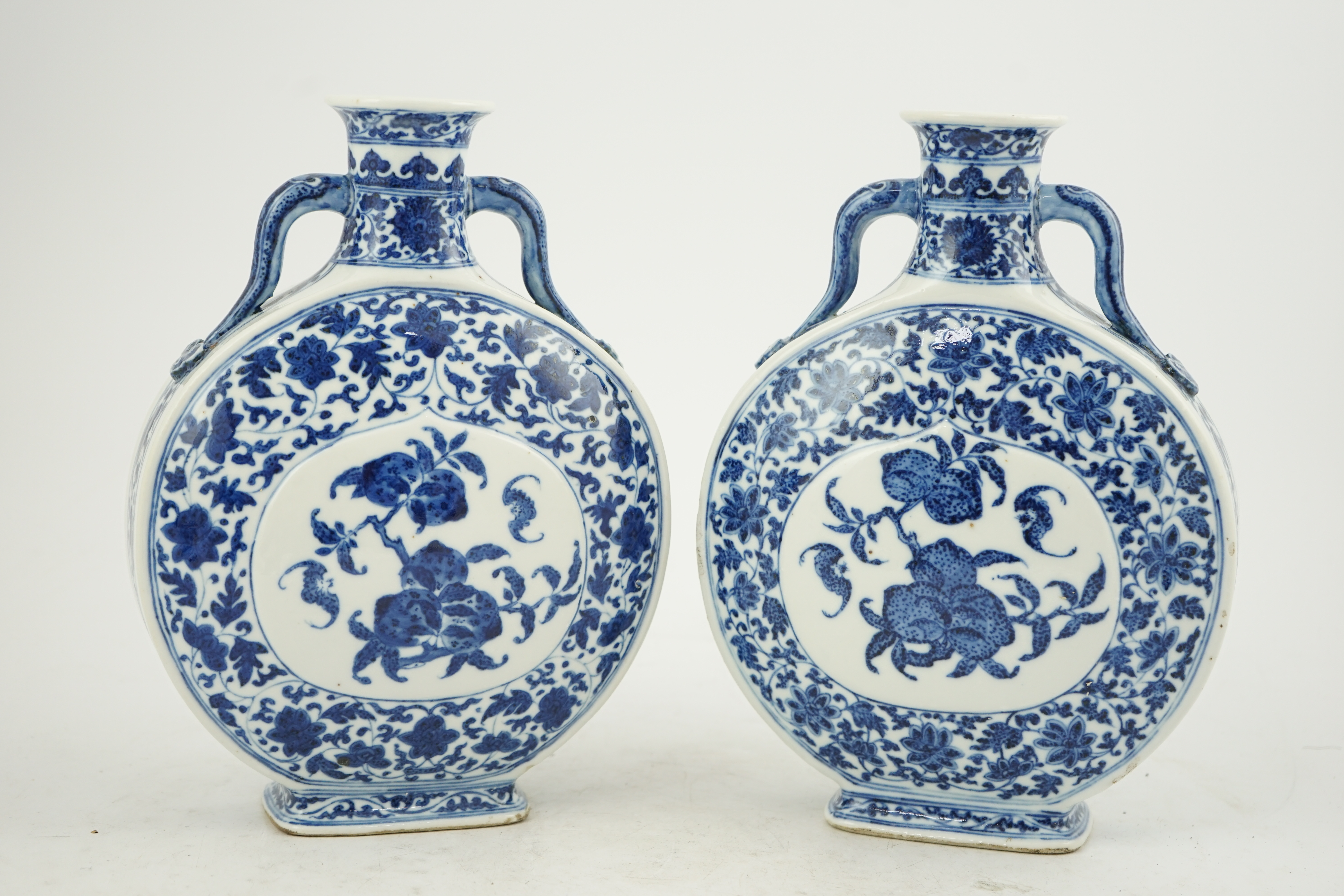 A near pair of Chinese blue and white moonflasks, bianhu, Daoguang seal marks and of the period (1821-50)